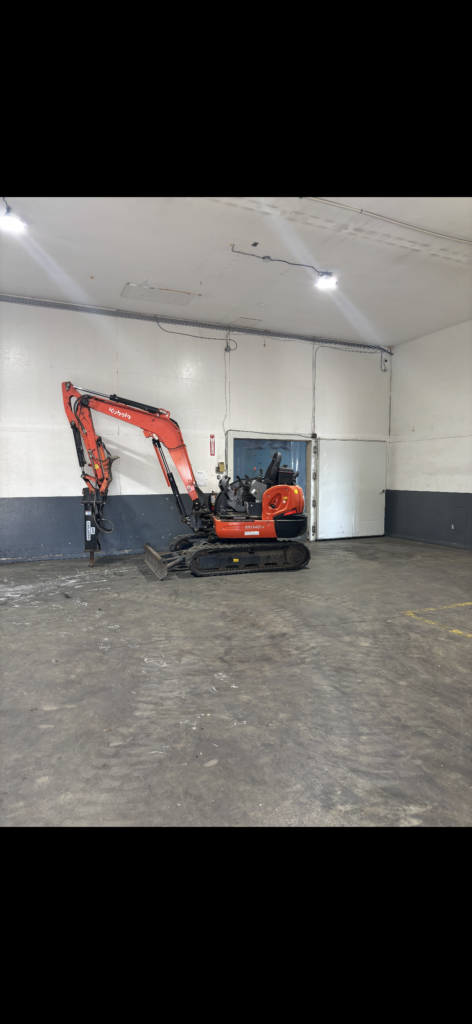 Kubota KX040 breaking concete indoors